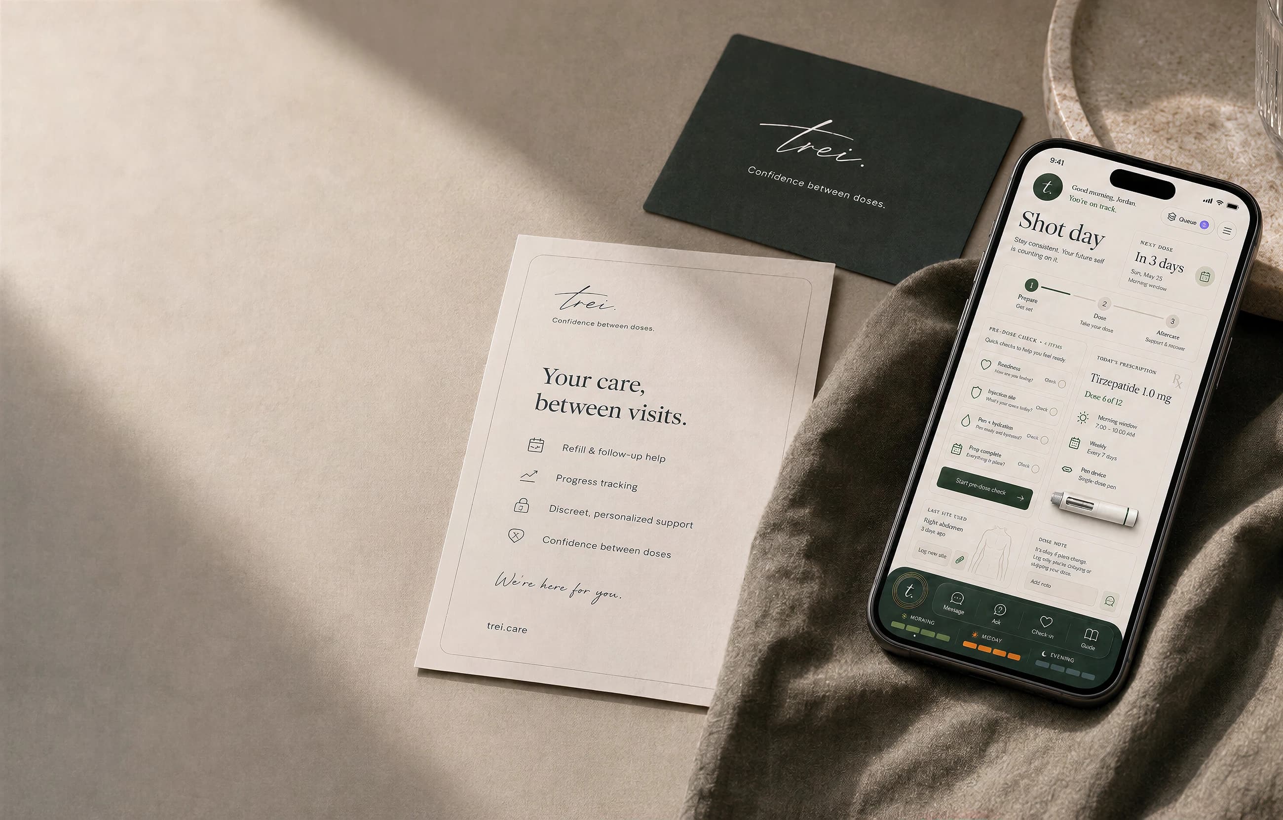 A trei care card and the app open on a phone, resting on a table